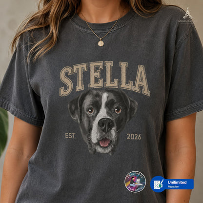 A woman wearing a pepper acid-wash graphic t-shirt featuring a custom black and white dog portrait and the name 'STELLA' in arched beige letters. 