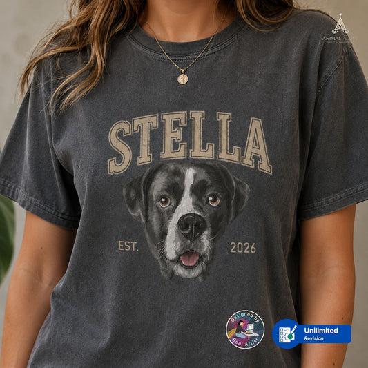 A woman wearing a pepper acid-wash graphic t-shirt featuring a custom black and white dog portrait and the name 'STELLA' in arched beige letters. 