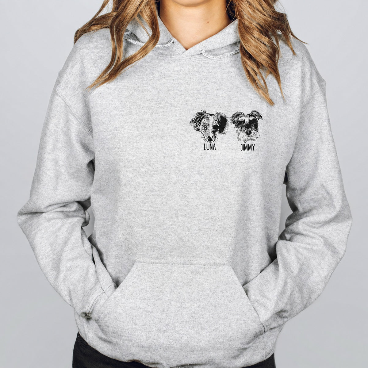 Gray hoodie showing two detailed custom pet face sketches with names beneath