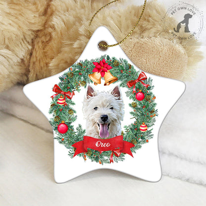 Round personalized pet ornament showing a white and black dog named Mandy on a Christmas tree