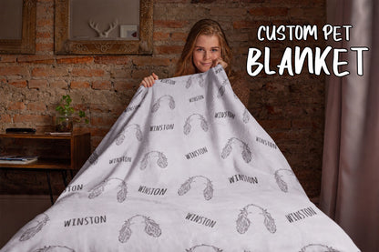 White personalized pet blanket with repeated floppy-ear line-art portraits and Winston names