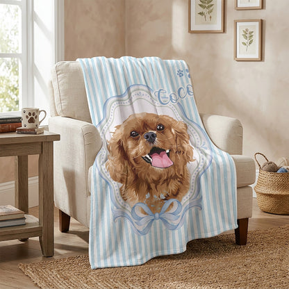 Blue striped personalized blanket with a cheerful curly-haired dog portrait named Coco