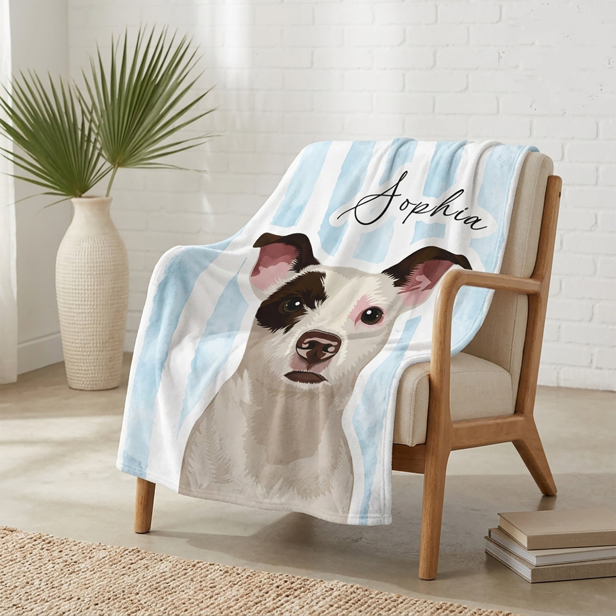 Personalized watercolor-style dog portrait blanket with the name Sophia draped over a wooden armchair