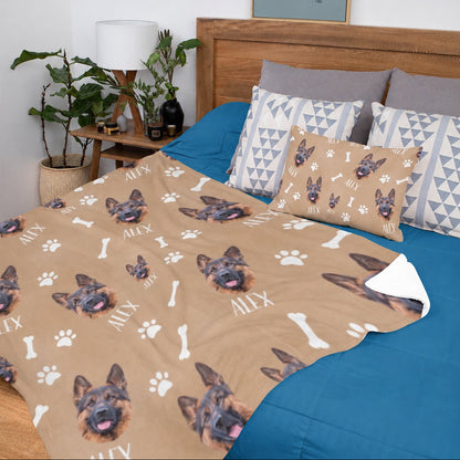 Tan personalized blanket and pillow decorated with repeated German Shepherd faces, the name Alex, paw prints, and bones