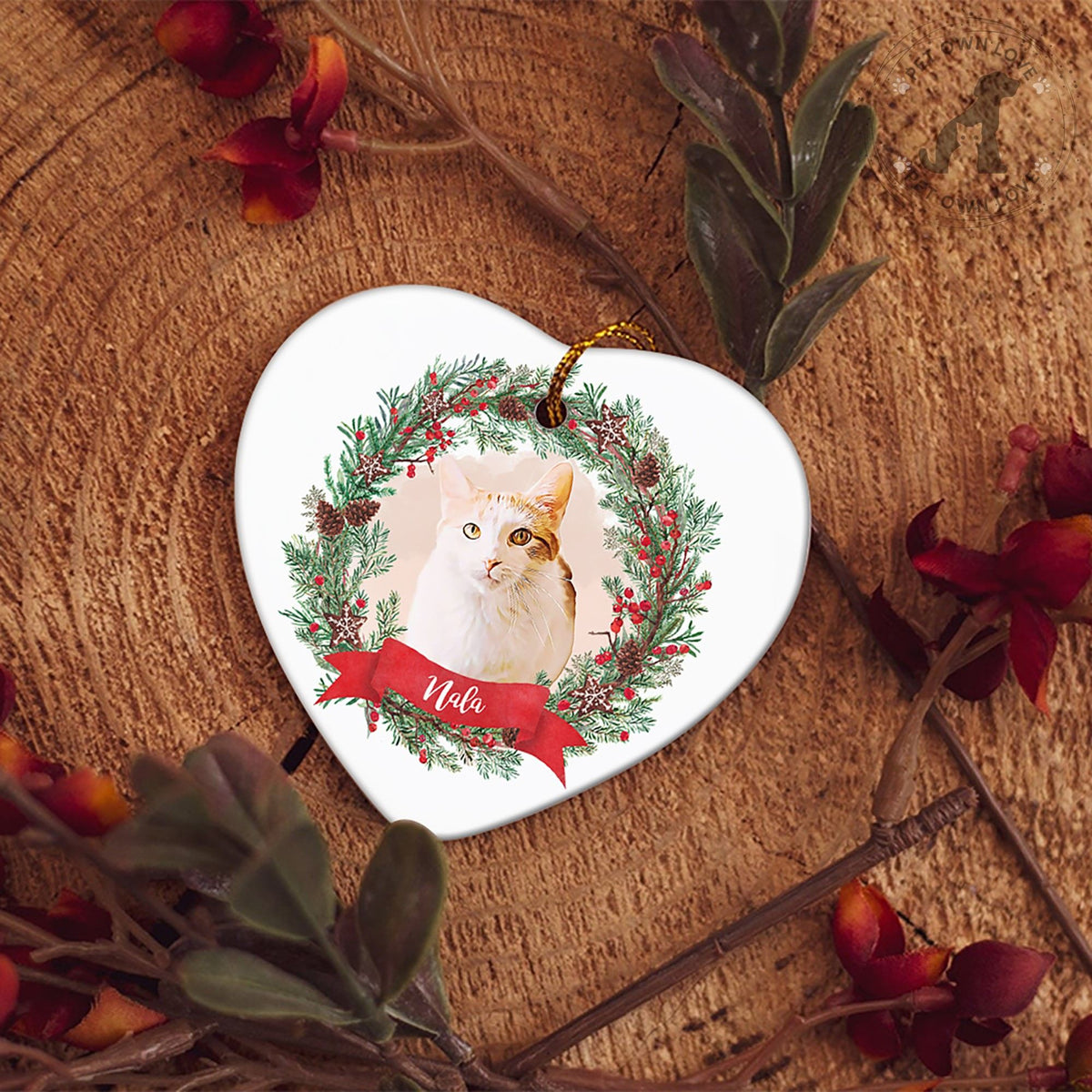 White heart-shaped pet ornament featuring a cat portrait, holiday wreath, and Lola name banner