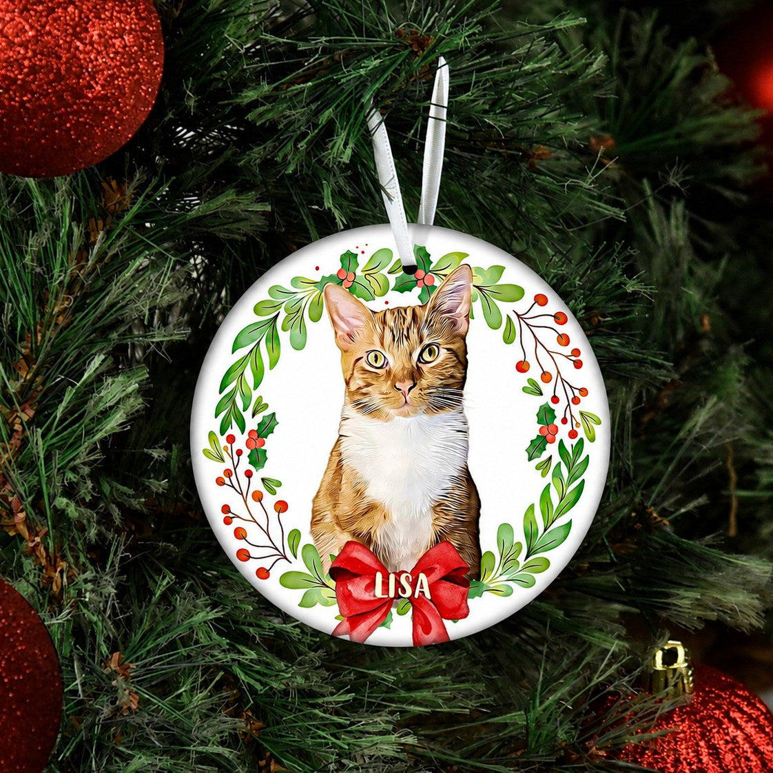 Personalized cat ornament with a tabby portrait, green foliage, berries, and red bow