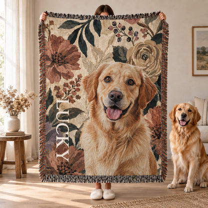 Person holding a fringed floral pet blanket featuring a golden retriever portrait and custom name