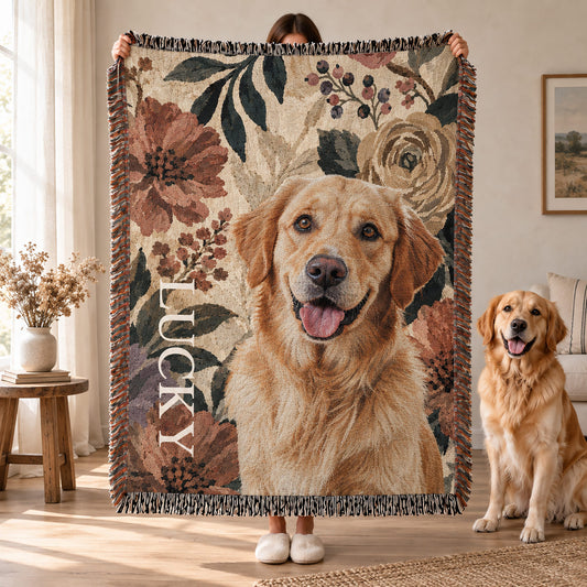 Person holding a fringed floral pet blanket featuring a golden retriever portrait and custom name