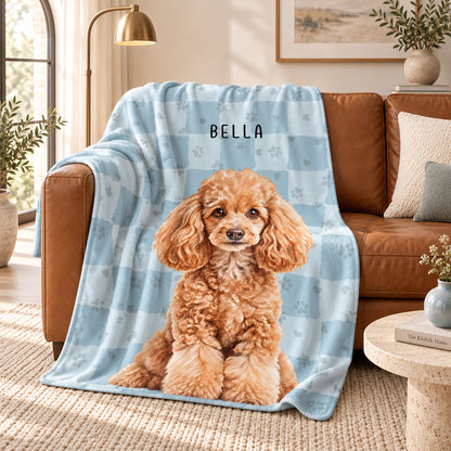 Personalized light blue pet blanket with a curly-haired dog portrait named Bella on paw-print and heart plaid