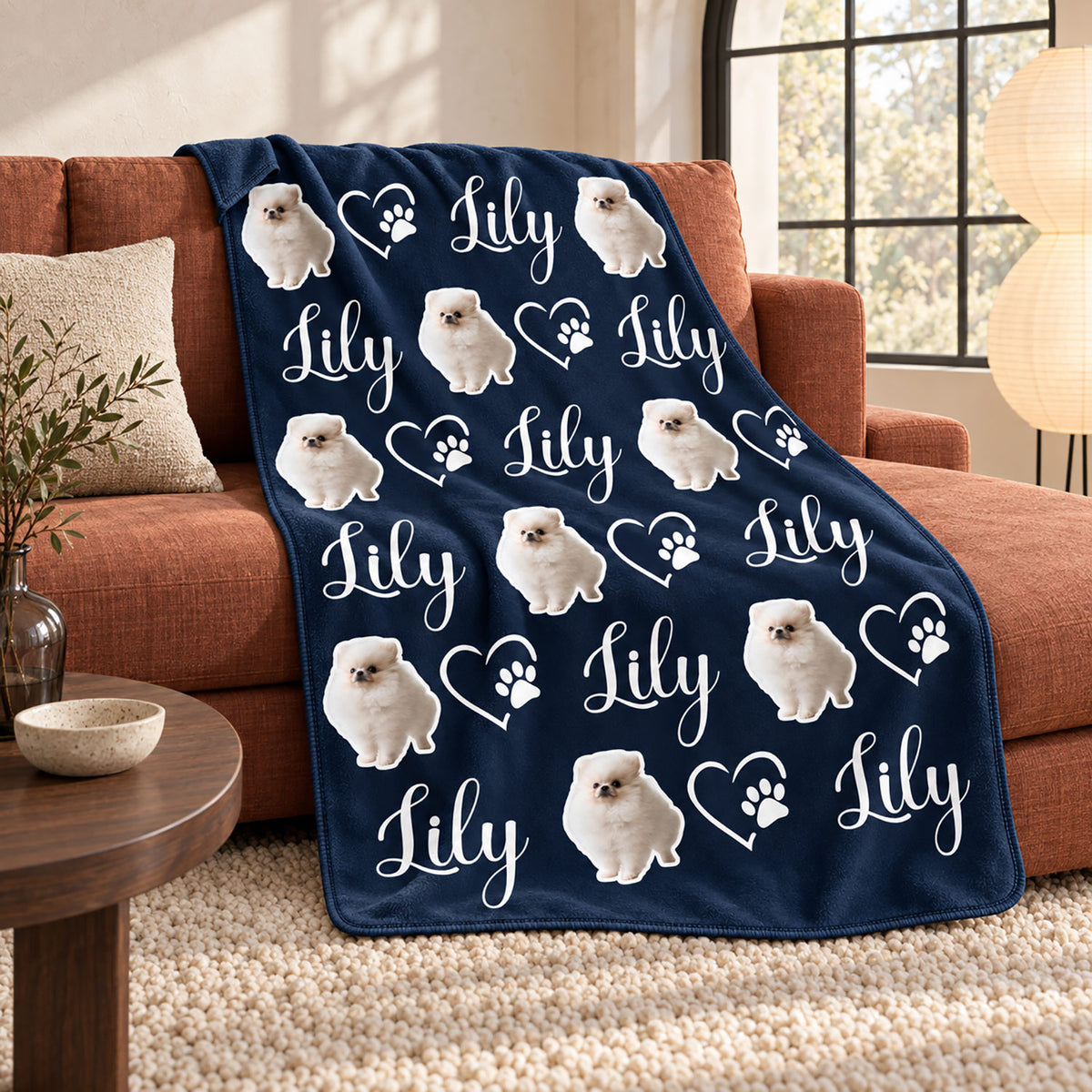 Navy personalized blanket with repeated fluffy white dog artwork, the name Lily, and heart paw designs