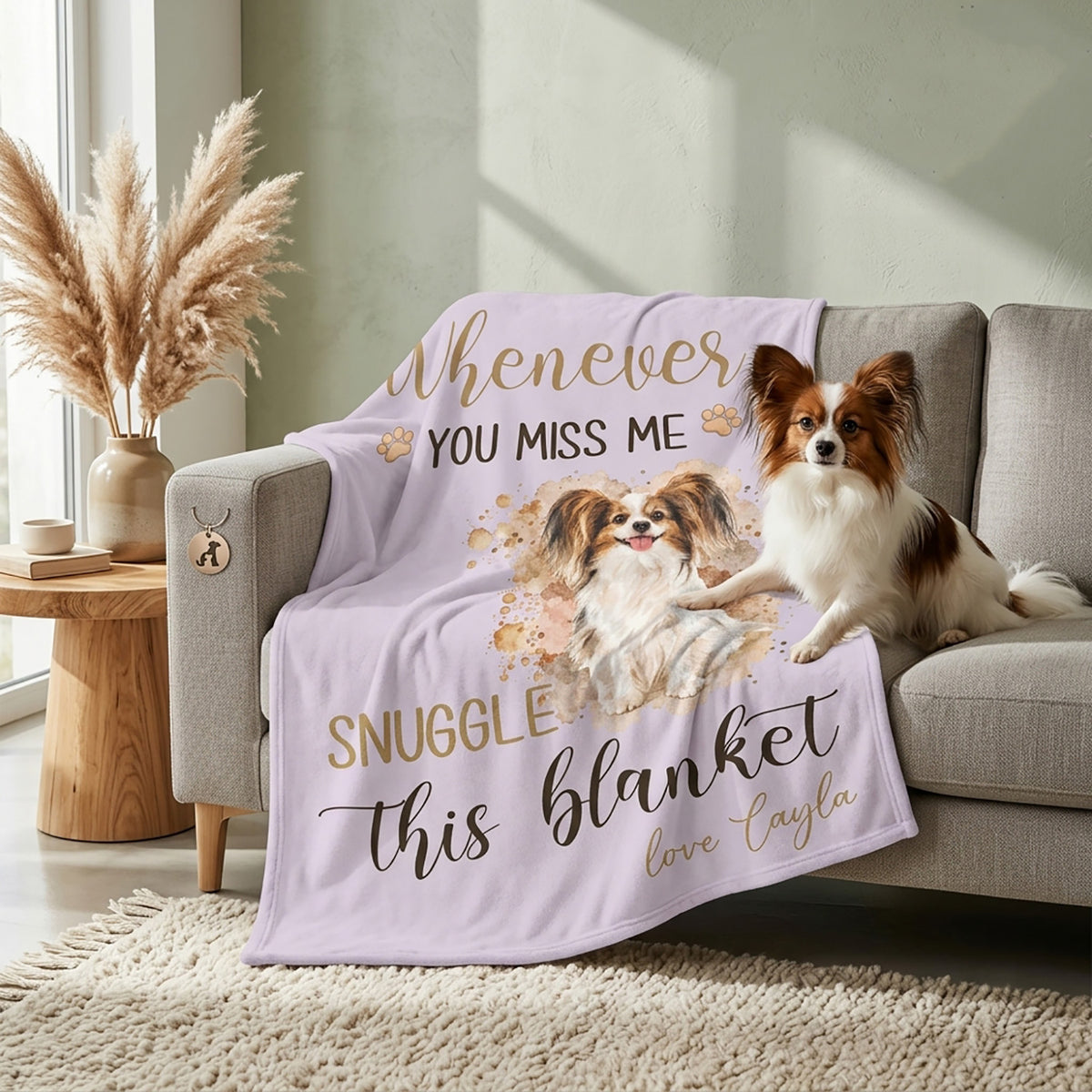 Lavender custom pet blanket draped over a sofa with watercolor dog portrait and paw prints